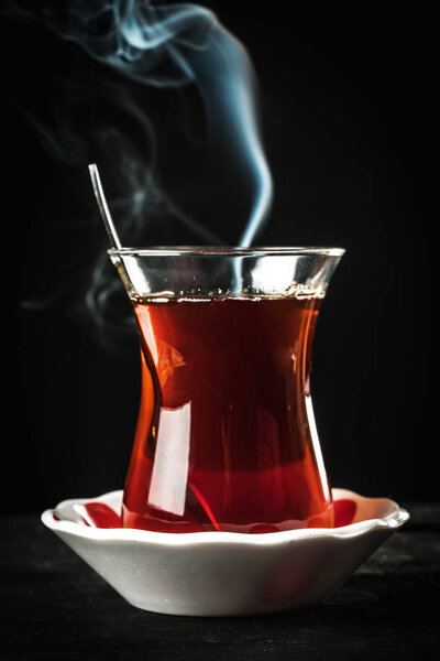 red hot tea and black background