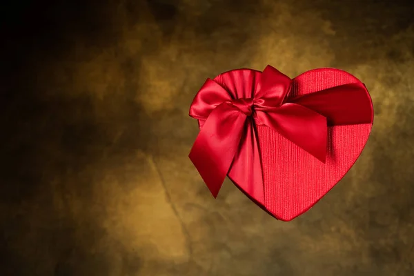 Red heart box on vintage background