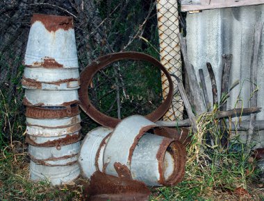 rusty buckets in the farmyard clipart