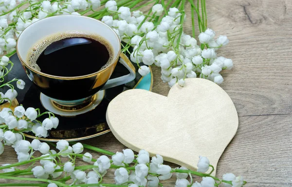 good morning. morning coffee and lily of the valley flower on a wooden table. mothers Day. women\'s Day. St. Valentine\'s Day.