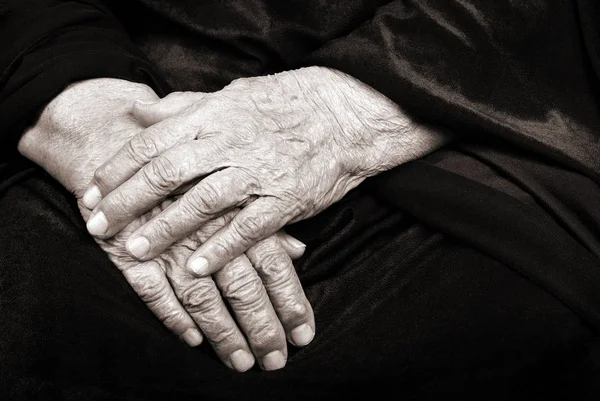 Wrinkled hands of an old woman. Copy spaces.  Mother\'s native hands. Black and white photography.