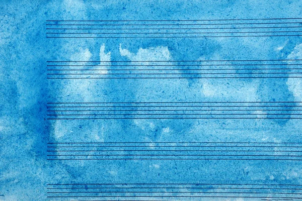Old music sheet in blue watercolor paint. Blues music concept. Abstract blue watercolor background. copy space