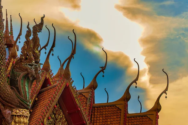 Roof Apex Style - Classical Thai Architecture. Cluster of roof apexes at Wat Tham Suea Temple, Thailand, with intricate details of roof elements, patterns, and color.