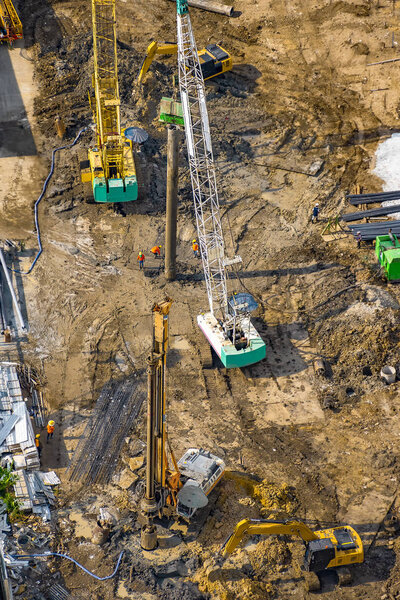 Aerial view of concrete bored pile foundation work on a construction site. 