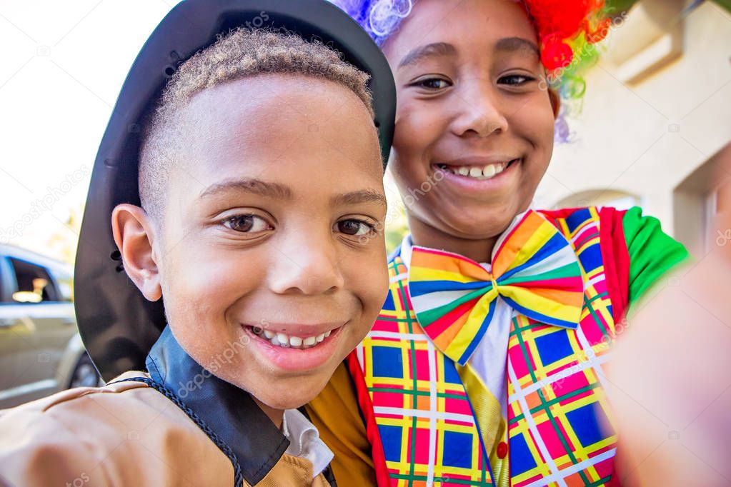 Boys in costume readysmiling at camera