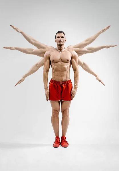 Guy Bodybuilder Athlete Does Warm Hands Parties Gray Background — Stock Photo, Image