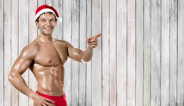 Fitness Sexig Santa Claus Visa Pekfinger Och Leende — Stockfoto