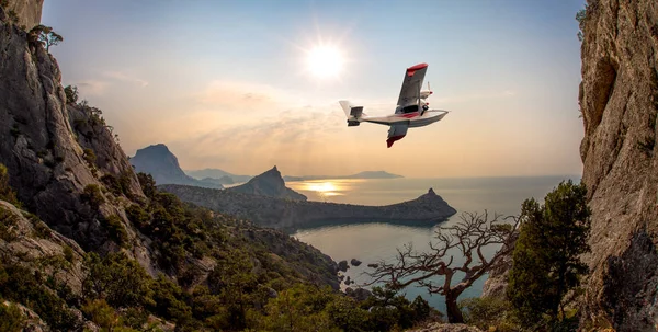 hydroplane flying over beauty sea bay , concept excursion on airplane, horizontal photo