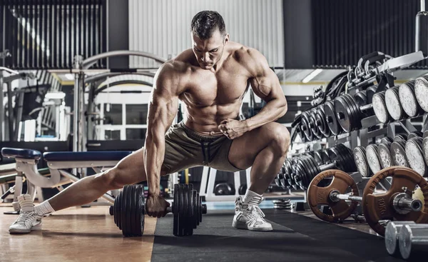 Guy Bodybuilder Perform Exercise Dumbbell Broadest Muscle Back Dark Gym — Stock Photo, Image