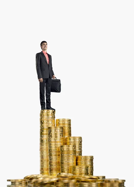 Businessman standing on rouleau gold  monetary — Stock Photo, Image