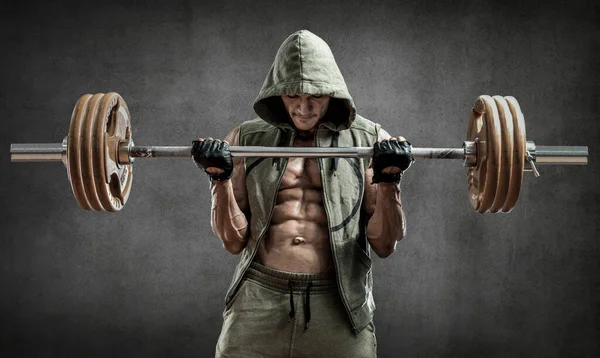 Man Bodybuilder Utföra Övning Med Vikt Skivstång Grå Vägg Bakgrund — Stockfoto
