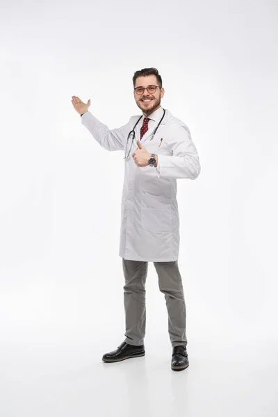 A portrait of a medical doctor posing against white background — Stock Photo, Image