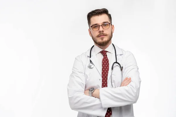 A portrait of a medical doctor posing against white background — Stock Photo, Image