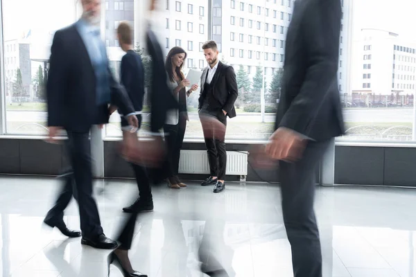 White collar workers going down office corridor during working day. — Stock Photo, Image