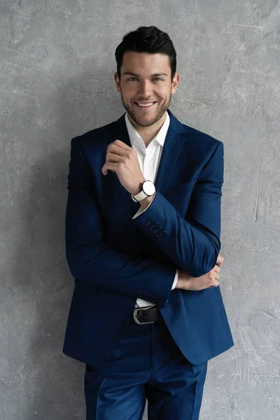 Handsome man wear blue suit isolated on grey background. — Stock Photo, Image