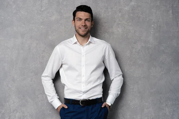 Handsome man wear blue suit isolated on grey background. — Stock Photo, Image