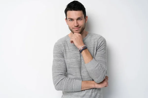 Handsome young man on white background looking at camera. Happy guy smiling — Stock Photo, Image