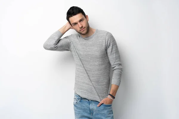 Handsome young man on white background looking at camera. Happy guy smiling — Stock Photo, Image