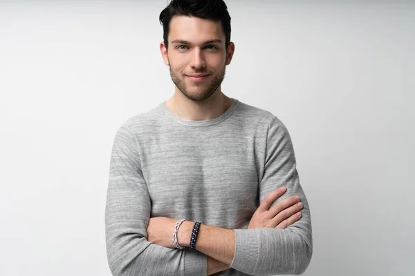 Handsome young man on white background looking at camera. Happy guy smiling — Stock Photo, Image