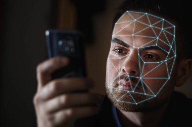 Bearded Man with smartphone using face ID recognition system clipart