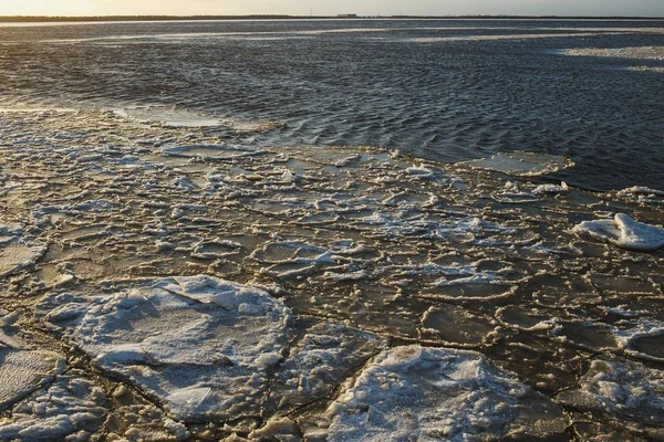Wide river freezing in sunny winter day. Ice formation. Sugar — Stock Image Wide river freezing in sunny winter day. Ice formation. Sugar Stock Photo
