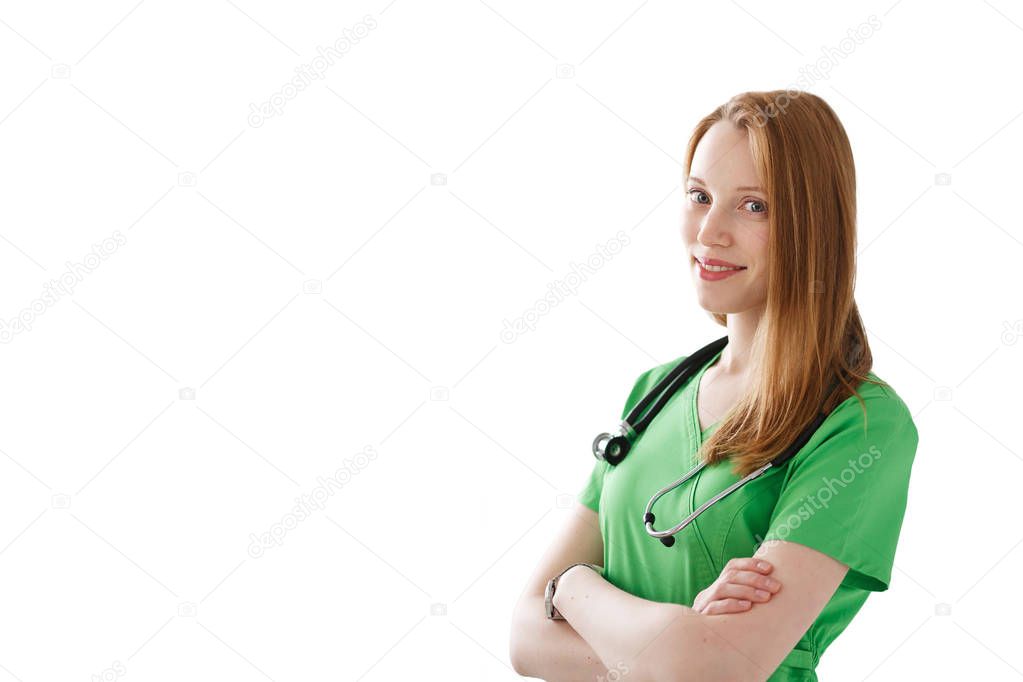 Portrait of smiling woman doctor with stethoscope and hammer in green medical gown isolated on white background