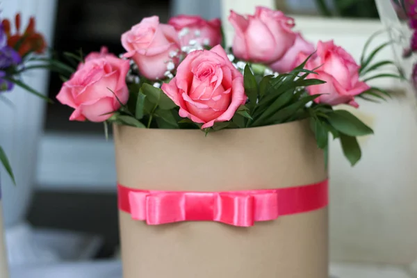 Beautiful bouquet of roses in a gift box. Bouquet of pink roses. Pink roses close-up.