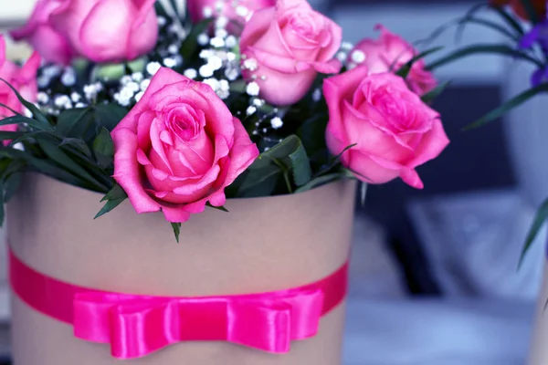 Beautiful bouquet of roses in a gift box. Bouquet of pink roses. Pink roses close-up.