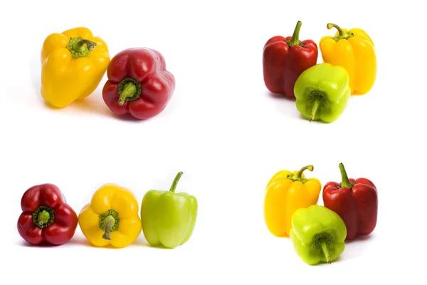 Sweet peppers on a white background. Red and yellow peppers on a white background. The colorful peppers in the composition.