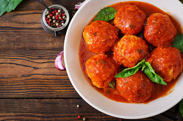 Meatballs in tomato sauce and toast with basil pesto. Dinner. Tasty food. Top view. Flat lay