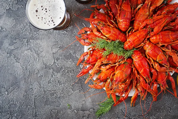 Crayfish. Red boiled crawfishes on table in rustic style, closeup. Lobster closeup. Border desig. Top view