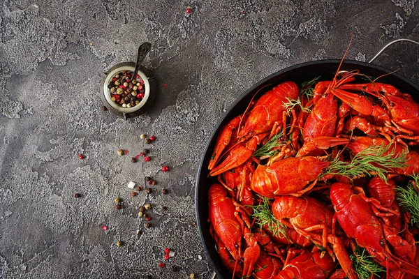 Crayfish. Red boiled crawfishes on table in rustic style. Top view with copy space