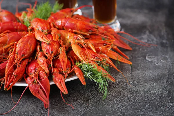 Crayfish. Red boiled crawfishes on table in rustic style, closeup. Lobster closeup. Border design