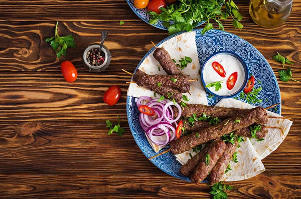 stock image Turkish and Arabic Traditional Ramadan mix kebab plate. Kebab adana, chicken, lamb and beef on lavash bread with sauce. Top view