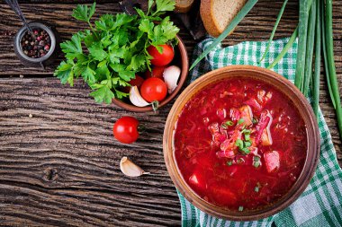 Traditional Ukrainian Russian borscht or red soup in the  bowl. Top view clipart