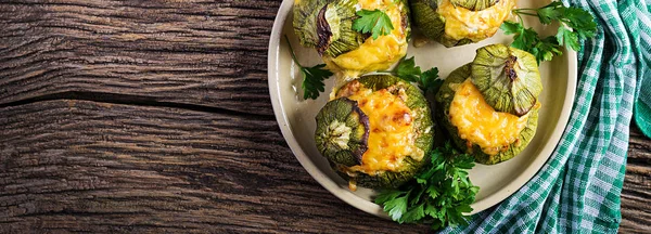 Zucchini stuffed with minced meat, cheese and green herbs. Baked — Stock Photo, Image