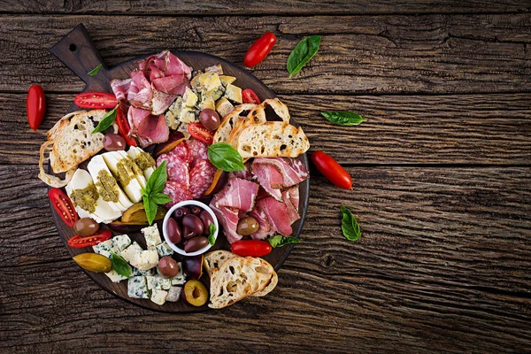 Antipasto Platter Ham Prosciutto Salami Blue Cheese Mozzarella Pesto Olives — Stock Photo, Image