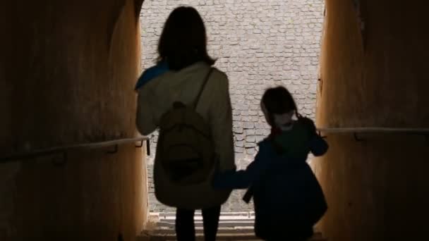 Mother with daughter going downstairs — Stock Video