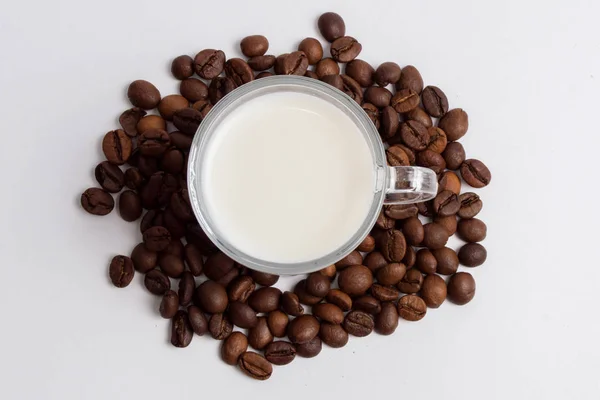 Glass Mug Full Milk Standing Pile Coffee Beans Royalty Free Stock Images