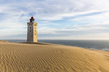 Rubjerg Knude lighthouse buried in sands on the coast of the North Sea clipart
