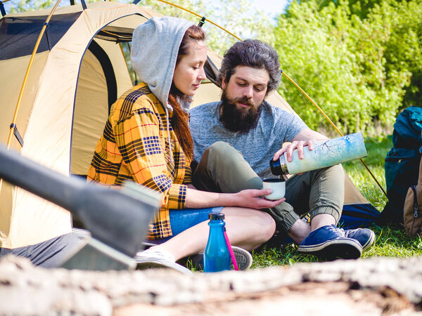 Couple have a rest in tent 