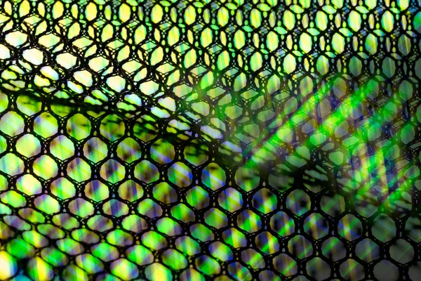 Detalhe artístico da rede ondulada com raios de luz — Fotografia de Stock