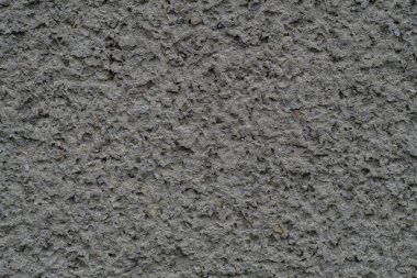 Taşlar doku arka plan malzemesi ile dekore edilmiş ev duvarı. Tasarım ve dekorasyon küçük taşlar ile. Beton ve mimari duvar kağıtları ve arka plan için.