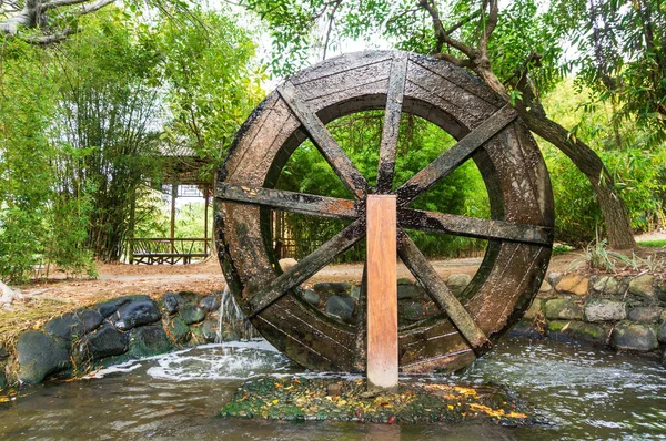 Wooden Wheel of Ancient Water Mill in Village