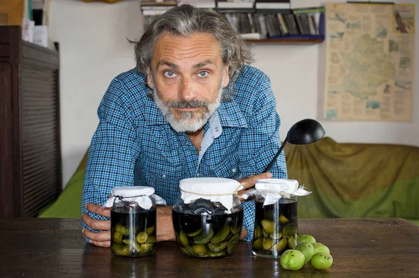 Man Posing Nocino Jars Italian Liqueur — Stock Photo, Image