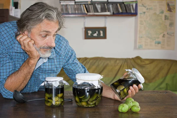 Man Posing Nocino Jars Italian Liqueur — Stock Photo, Image