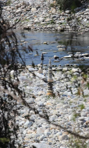 river stones piles along Sesia River Piedmont, Italy