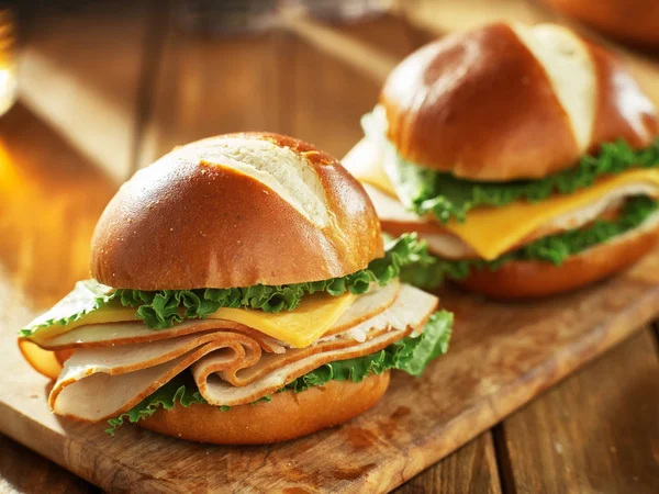 Two Cold Cut Style Turkey Cheese Sandwiches Pretzel Buns — Stock Photo, Image