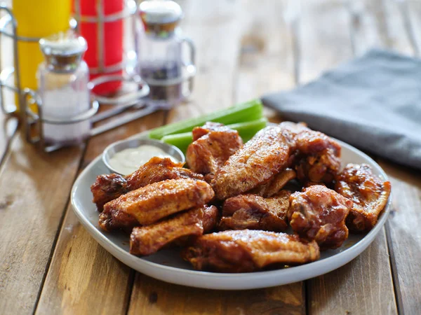 Plate Bbq Chicken Wings Ranch Dip Celery Sticks Wooden Table — Stock Photo, Image