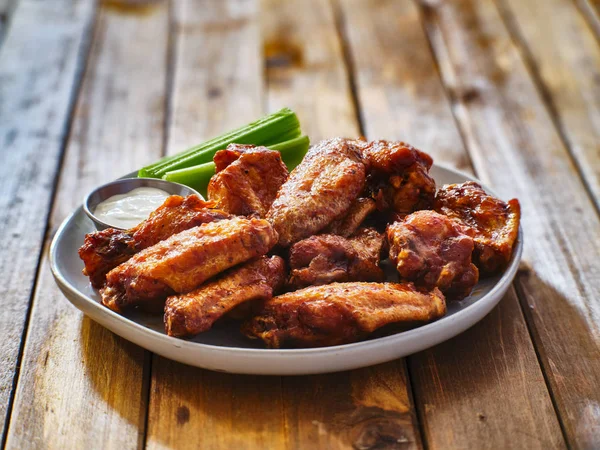 Plate Bbq Chicken Wings Ranch Dip Celery Sticks Wooden Table — Stock Photo, Image